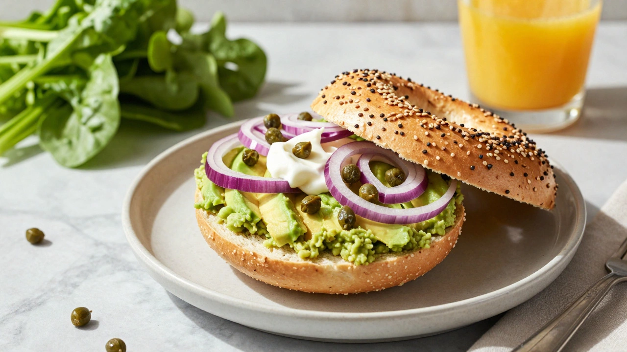 Vegan everything bagel topped with avocado, cashew cream, and red onion